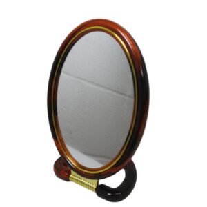 A double-sided oval desk mirror with a stand measuring 22 cm is a versatile and practical accessory for personal grooming or makeup application. The mirror typically features...