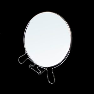 A double-sided round desk mirror with legs, measuring 6 inches, typically features two reflective surfaces. One side is usually a regular mirror, while the other side may offer...