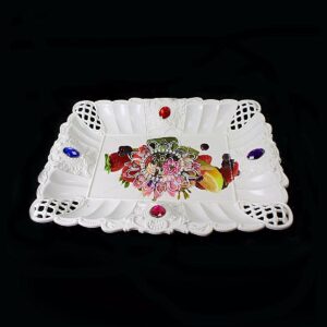 It sounds like you're describing a product listing for a serving tray. This tray features a "Fruit Jewelled" design, which likely means it has decorative fruit patterns or...