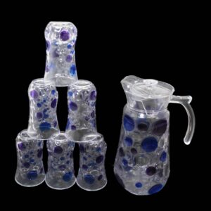 The "7 Piece Glassware Set" includes a water jug and six tumbler glasses. Each piece in this set features a colored effect design, adding a touch of style to your tableware...