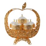 The Durane Metal/Plastic Ornate Party Serving Tray Stand in Gold, model A045G Apple 11038, appears to be a decorative serving tray stand designed for party or event use. The...