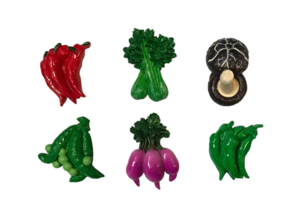 The "Fridge Magnet Vegetable Design 6 cm Assorted Designs 7050" likely refers to a set of fridge magnets that are designed to resemble various vegetables. These magnets are each...