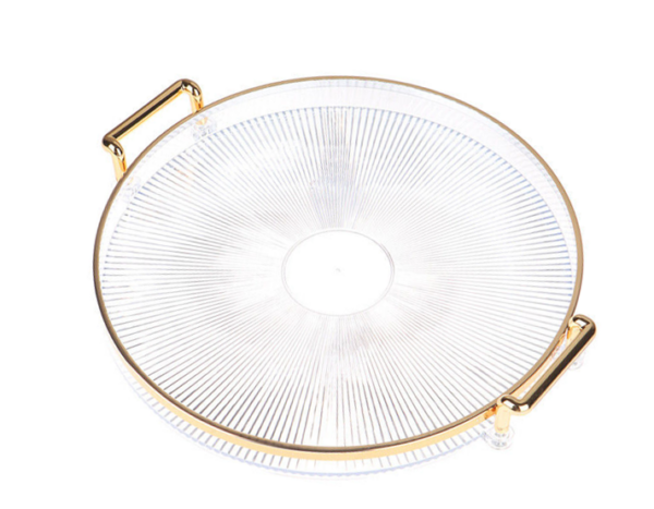 The item you're describing appears to be a round, transparent plastic serving tray with a gold rim and handles, measuring 32 cm in diameter. The model number or product code...