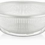 The "Plastic Strainer with Bowl 7L Assorted Colours D10212 A" is a kitchen tool typically used for straining and rinsing ingredients such as pasta, vegetables, or fruits. The...