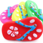 The product you're referring to seems to be a pet toy designed for dogs. It's a squeaky slipper or flip-flop toy, which likely comes in assorted colors. The size is specified as...