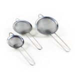 The "Stainless Steel Fine Mesh Strainer Sieve Set of 3 Assorted Sizes 1049 A" likely refers to a kitchen tool set that includes three strainers of different sizes. These are...