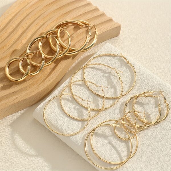 A Set Of 8 Pairs Of Simple And Stylish Twisted Wave Sparkling Earrings In Golden And Silvery Colors. - Image 6